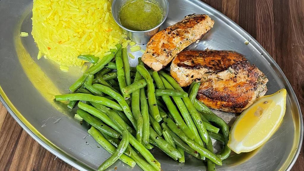 Atlantic Grilled Salmon · Fresh Atlantic salmon marinated then grilled to perfection served with rice & Vegetables.