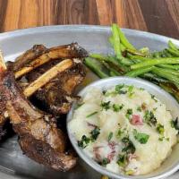 Lamb Chops · Succulent frenched baby lamb chops served with mashed potatoes & Vegetables.