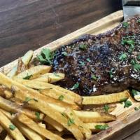 Steak Frites · 10oz cut of usda prime NY striploin cooked to your liking, served with hand cut fries & Vege...