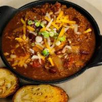 Full Size Chili · Our famous beef chili topped with cheddar jack cheese, sour cream & Green onions.