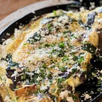 Wild Omelet · Baby spinach, roasted garlic, portabella mushrooms, & feta cheese. served with toast.