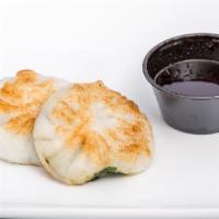 Gui Chai (Chive) · Gluten free. Two crispy golden dumpling “rice flour” stuffed with chives and glazed with hom...