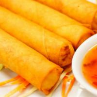 Crispy Rolls · Four crispy spring rolls stuffed with chicken, cabbage, carrots, bean threads served with sw...