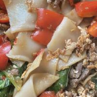 Drunken Noodles* (Kee Mao) · Spicy, Vegetarian. Flat rice noodles sautéed with fresh chili, 
collard greens, tomatoes, eg...
