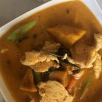 Red Curry** · Spicy, Gluten free. Red curry in coconut milk with zucchini, baby corn, peas, string beans a...