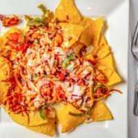 Fajita Nachos · Your choice of meat cooked with bell peppers, tomatoes, and onions.

Foods cooked to order, ...