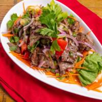 Beef Salad (Grilled Flank Steak) · Spicy level 1. Red onions, scallions, bell peppers, tomatoes, cucumber in spicy lime juice.