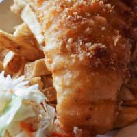 Fish And Chips · Crispy beer battered haddock (6 oz) served with our seasoned fries, a side of coleslaw, and ...
