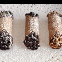 Cannolis · Pastry shells filled with a sweet cream and dusted with powdered sugar. Toppings: Chocolate ...