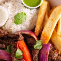 Lomo Saltado · Steak strips sautéed in fresh vegetable oil, red onion, tomato, French fries, fresh cilantro...