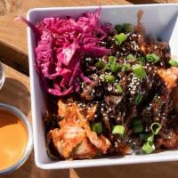 Bulgogi Korean Bbq Bowl · Marinated sliced beef ribeye served on a bed of white rice, mixed greens, kimchi, topped wit...