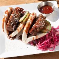 Pork Belly Bao · Thick sliced and crispy pork belly served inside two steamed buns with cucumber, honey hoisi...