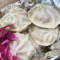 Pork Soup Dumplings · 6 piece soup dumplings filled with minced pork and soup broth served with sweet chili sauce....