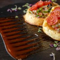 Chilli Cheese Toast · Garlic toast topped with Amul cheese, bell peppers, and cherry tomatoes.