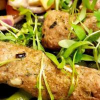 Lamb Seekh Kebab · Skewered minced lamb with basil, peppers, mint oil.