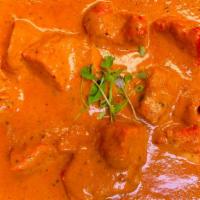 Butter Chicken · Tandoori chicken tikka in a creamy tomato and butter flavored sauce with a hint of ginger, g...