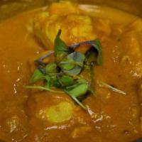 Mango Curry · Mango, onion, tomato and coconut flavored spiced curry