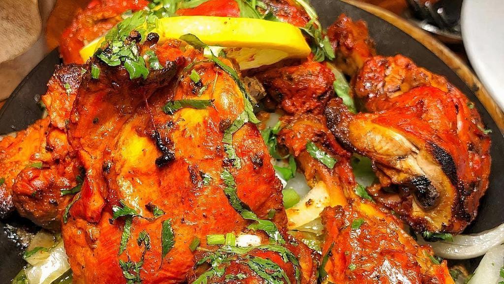 Tandoori Chicken · Marinated half spring chicken roasted in tandoor