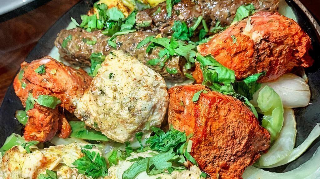 Mixed Tandoori Grill · Chicken tikka, malai kebab, lamb seekh kebab, tandoori shrimp.