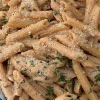 Penne Alla Vodka  · Penne pasta in a pink cream sauce with grilled chicken, crispy pancetta, fresh basil and gra...