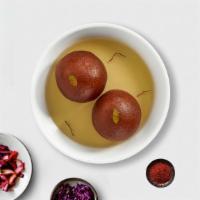 Glazed Gulab Jamun · Soft milk dumplings in a sweet rosewater syrup. (Two Pieces)