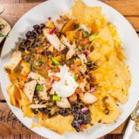 Loaded Nachos · pico de gallo, black beans, melted choice of cheese, choice of protein.