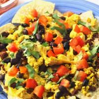 Breakfast Nachos · pico de gallo, black beans, melted choice of cheese, bacon, fried egg.