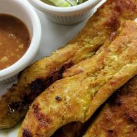 Chicken Satay · Chicken marinated with special curry sauce on stick. Serve with peanuts sauce.