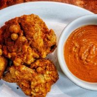 Berbere Chicken (Hot) · Fresh Chicken Battered and Twice Fried and Seasoned with Cardamom, Berbere Chilis, Ginger, a...