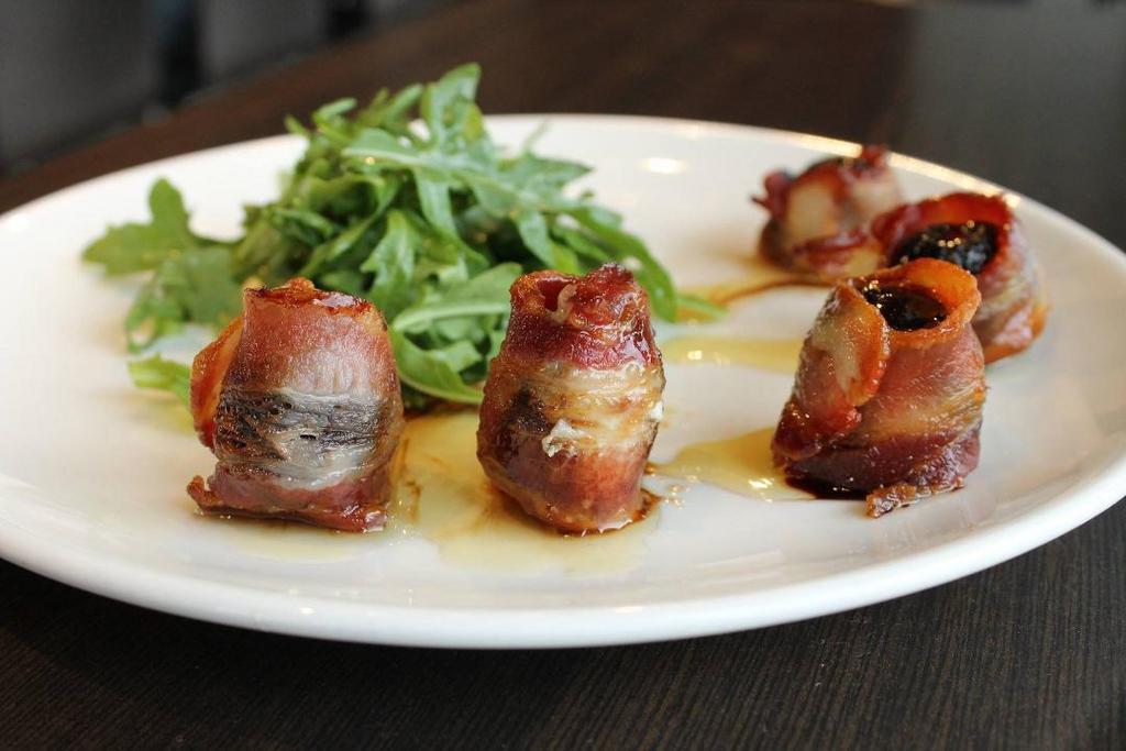 Bacon Wrapped Figs · Black Mission figs, Gorgonzola, bacon, balsamic reduction, honey.