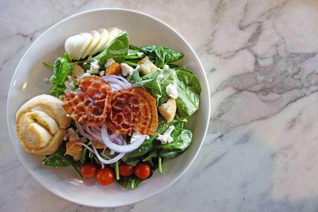 Spinach & Goat Cheese Salad · Pancetta crisp, croutons, Goat cheese, egg, cherry tomatoes, red onions, honey mustard vinaigrette.