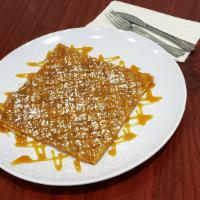 Sleek Caramel Crepe · Our signature Sleek Crepe filled and topped with Caramel and powdered sugar.