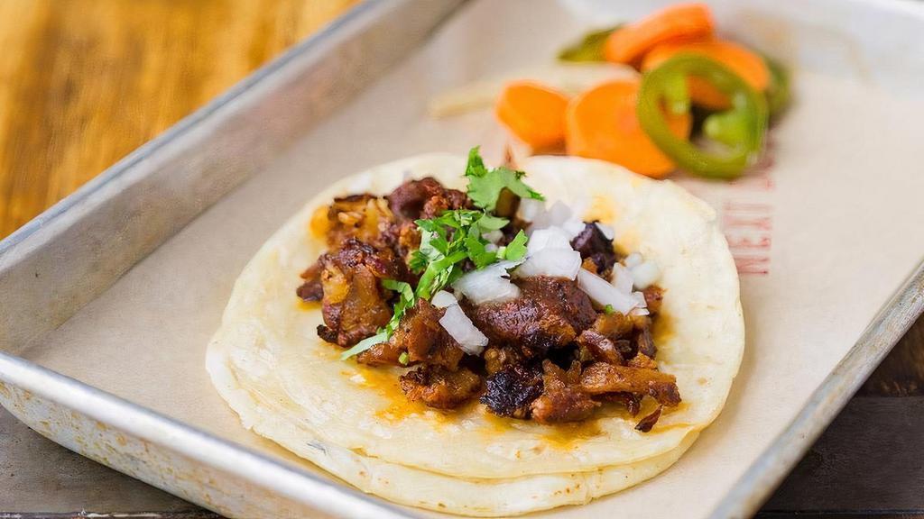 Al Pastor Taco · Berkshire pork al pastor(contains gluten), chipotle salsa, cilantro, onions