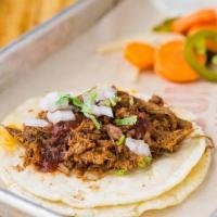 Beef Taco · Beef barbacoa, chipotle salsa, cilantro, onions