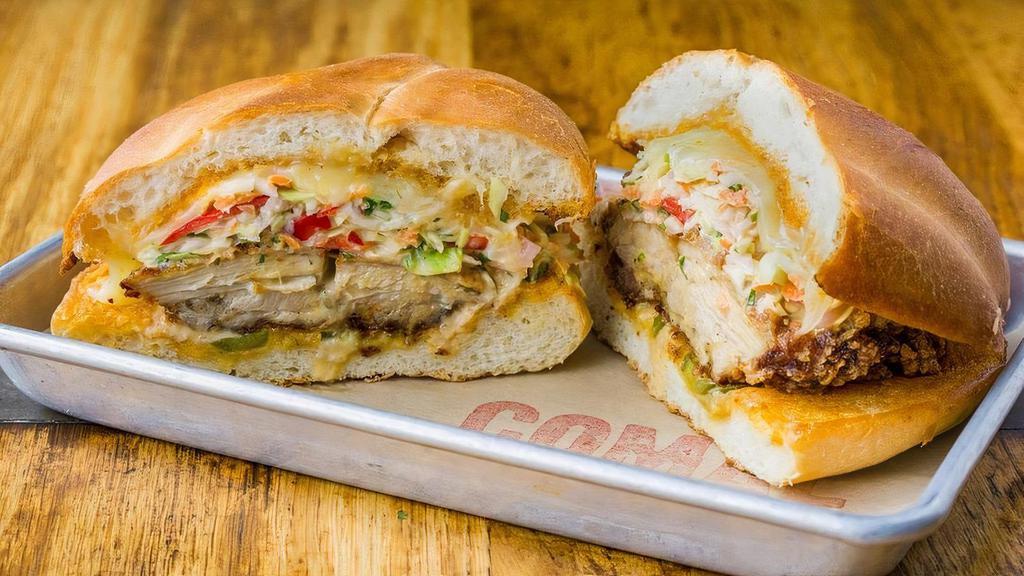Fried Chicken Torta · Buttermilk fried chicken, spicy cabbage slaw, pickled jalapeños, jack cheese, chipotle aioli, griddled telera roll