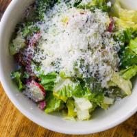 Next Door Salad · Little gem lettuce, pepitas, radish, pickled onions, cotija, rajas, avocado, cilantro-lime v...