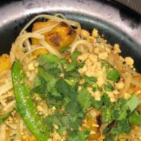 Classic Pad Thai · Gluten-Free Upon Request. Spicy. Chicken, egg, tofu, cilantro, peanuts, pea pods, flat rice ...