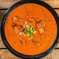 Butter Chicken · Grilled chicken (Tandoori chicken) simmered in a spicy, aromatic, creamy tomato gravy (also ...