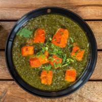 Saag Paneer · Cooked spinach with cubes of paneer cheese.