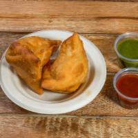 Samosa Appetizer (3 Pieces) · Fried, savory, flaky pastries filled with potato and peas. Served with chutney.