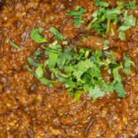 Baingan Bharta · Fire roasted eggplant mash cooked with Indian spices