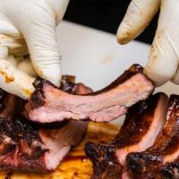 Baby Back Ribs - Half Rack · Competition-style baby back pork ribs, seasoned and smoked until tender and lightly glazed w...