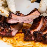 Baby Back Ribs - Full Rack · Competition-style baby back pork ribs, seasoned and smoked until tender and lightly glazed w...