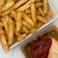 French Fries · Crispy french fries seasoned with steak rub and served with ketchup and comeback sauce