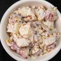 Chesapeake Potato Salad · Red-skinned potatoes, sweet corn, and pickles in a creamy Old Bay dressing. (1 cup)
Vegetari...