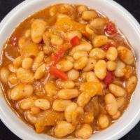 Peach Bourbon Baked Beans · Bourbon-sauteed onions and peppers, house-made peach pie filling, white beans, finished in t...