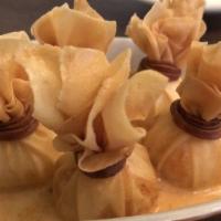Crab Rangoon · Deep-fried wonton wrapper, cream cheese filling with crab meat, carrots, served with Thai ch...