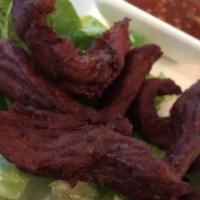 Beef Thai Jerky · Sun dried Thai style marinated beef, deep-fried and served with Thai salsa sauce