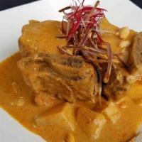 Short Rib Masaman · Tender short ribs in homemade masaman curry, coconut milk, potatoes, onions, peanuts, and ta...