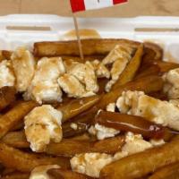 Poutine · Authentic Montreal poutine made with hand-cut fries, our house cheese curds and real vegetar...